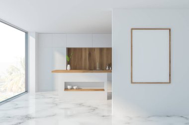 Tezgahı ve posteri olan mermer bir mutfak.