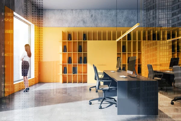 Businesswoman in bright yellow loft office — Stock Photo, Image