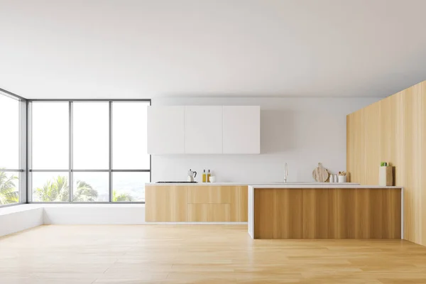 Просторный интерьер деревянной и белой кухни — стоковое фото