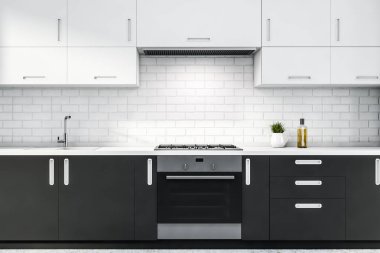 Gri tezgahlı beyaz tuğlalı mutfak.