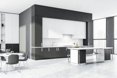 Masası ve barı olan gri ve beyaz tuğlalı mutfak.