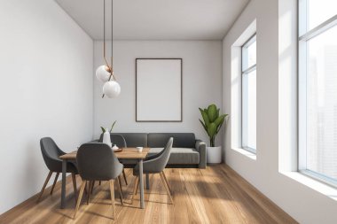 İçi beyaz yemek odası, kanepe ve poster.