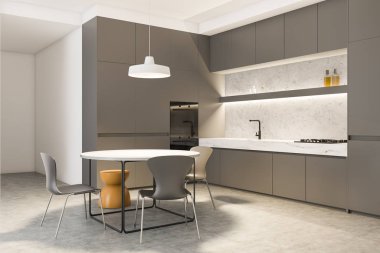 Yuvarlak yemek masalı gri mutfak