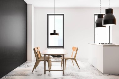 Beyaz ve siyah mutfak. Yemek masası var.