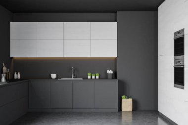 Gri tezgahlı şık bir mutfak.