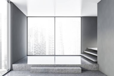 Boş gri panoramik odanın içi merdivenlerle dolu.