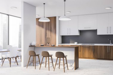 Bar ve masa ile beyaz mutfak köşesi