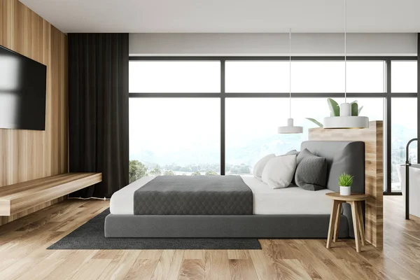 Wooden bedroom interior with TV and bathroom