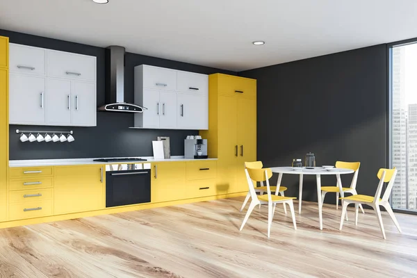 Yellow and gray kitchen with round table — Stock Photo, Image