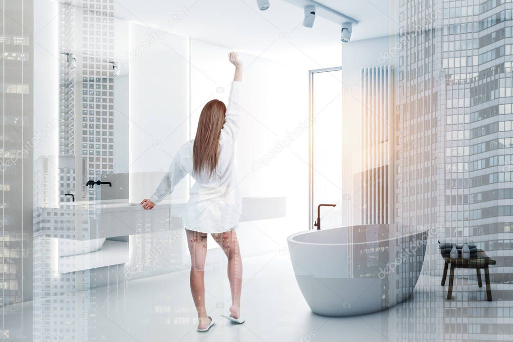Woman in comfortable white bathroom corner