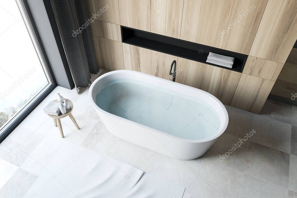 Top view of white tile floor bathroom with tub