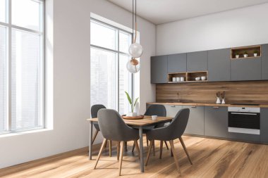 Masa ile beyaz ve gri mutfak köşesi