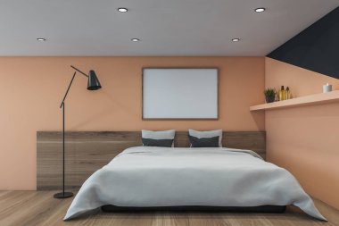 Afişi olan bej ve siyah yatak odası.