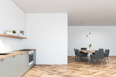 Masa ile beyaz mutfak yan görünümü