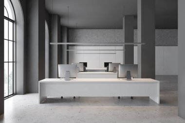 Computer desks in white and gray office