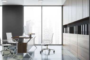 Kitaplığı olan gri Ceo ofisinin yan görünümü