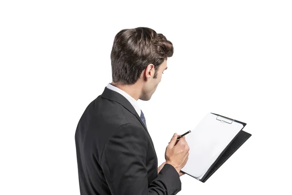 Handsome young businessman with clipboard — Stock Photo, Image