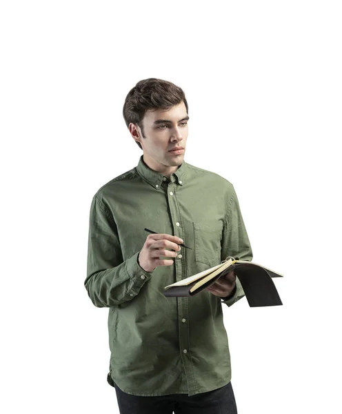 Nachdenklicher junger Mann mit Notizbuch — Stockfoto
