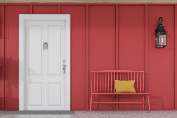 Białe drzwi frontowe czerwonego domu z ławką — Zdjęcie stockowe