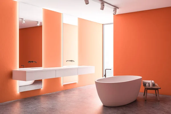 Orange bathroom corner, tub and double sink