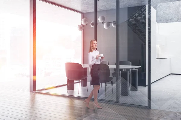 Blonde woman in stylish dining room — Stock Photo, Image