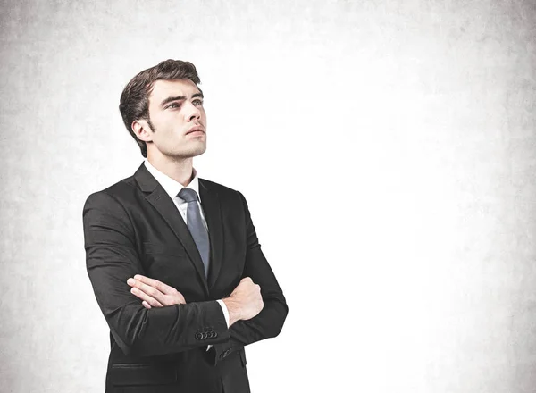 Thoughtful confident businessman with crossed arms — Stock Photo, Image