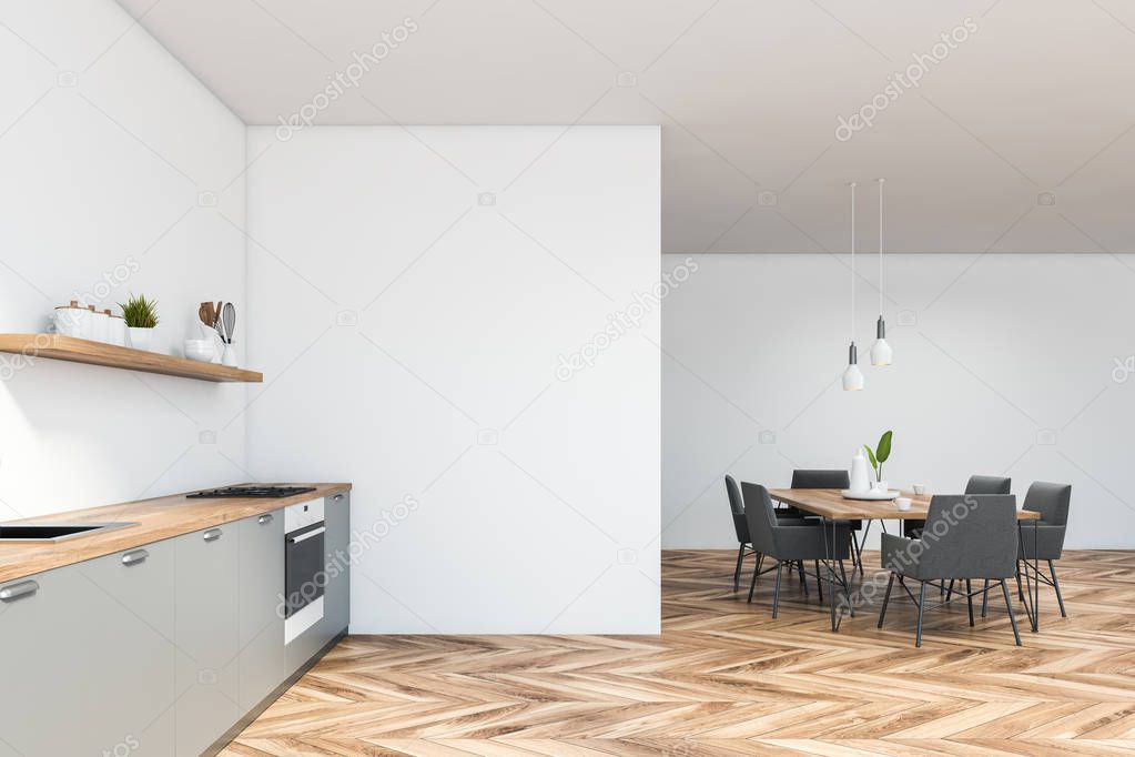 Side view of white kitchen with table