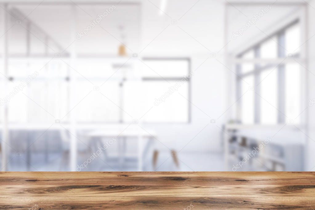 Table in blurry white meeting room