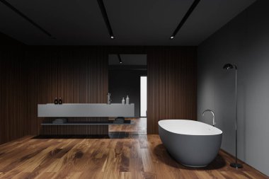 Moda İskandinav banyo iç mimarisi gri ve ahşap duvarlar, koyu ahşap zemin, yerde lambalı rahat küvet ve aynalı büyük gri lavabo. 3d oluşturma