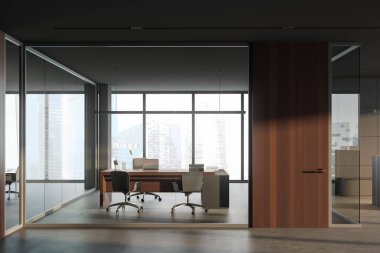 Gri ve cam duvarları, ahşap kapısı, ziyaretçiler için sandalyeleri ve bulanık şehir manzarası olan rahat bilgisayar masası olan modern CEO ofisinin içi. Liderlik kavramı. 3d oluşturma