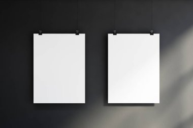 Reklam ve ürün yerleştirme konsepti. Gri duvarda asılı iki dikey maket poster. 3d oluşturma