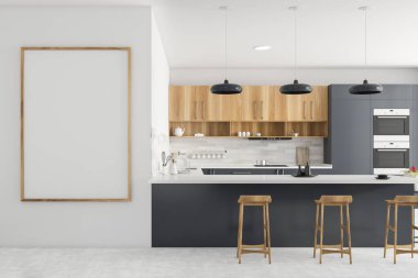 Gri ve beyaz duvarları olan modern mutfağın içi, gri tezgahlar, ahşap dolaplar, tabureli bar, iki fırın ve dikey poster çerçevesi. 3d oluşturma