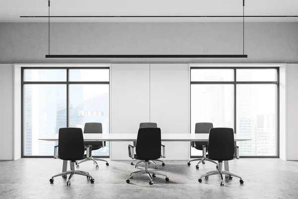 Interior of stylish meeting room with white and stone walls, long conference table with black chairs and windows with blurry cityscape. 3d rendering