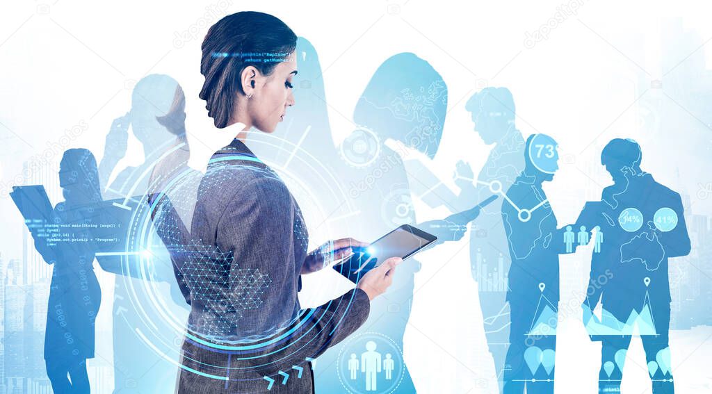 Young businesswoman using tablet computer with her teammates in background with double exposure of HUD interface. Teamwork and technology. Toned image. Elements of this image furnished by NASA