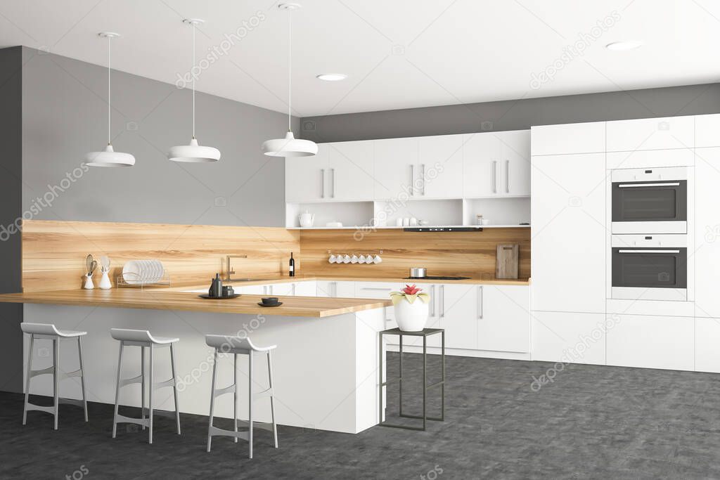 Corner of stylish kitchen with white and grey walls, white countertops and cupboards, bar with stools, two ovens and window with blurry cityscape. 3d rendering