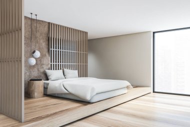 Çağdaş tavan arası yatak odasının köşesinde bej ve gri duvarlar, ahşap zemin, rahat kral yatağı, yatağın yanında yuvarlak masa ve arka planda raflar. Bulanık şehir manzaralı büyük bir pencere. 3d oluşturma