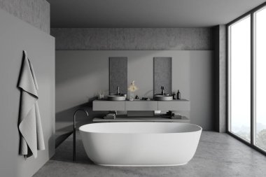 Gri ve taş duvarlı panoramik banyonun içi, taş zemin, rahat banyo küveti, gri tezgahların üzerinde çift lavabo ve bulanık dağ manzaralı pencere. 3d oluşturma