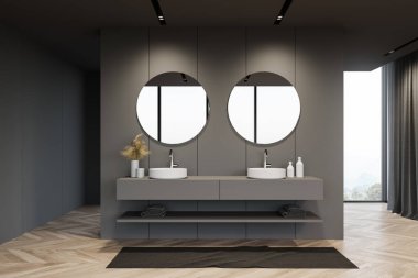 Gri duvarları, ahşap zemini ve iki yuvarlak aynalı rahat lavabosu olan şık bir banyo. Bulanık dağ manzaralı bir pencere. 3d oluşturma