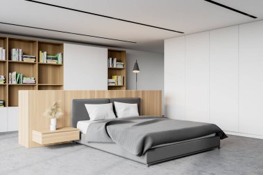 Beyaz duvarları, beton zemini, rahat kral yatağı ve kitaplığı olan şık bir yatak odası. 3d oluşturma