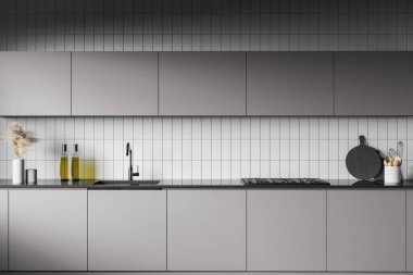 Gri dolapları ve mutfak tezgahlarını kapayın. Ocakta ve lavaboda beyaz fayanslı duvarları olan şık bir mutfakta durun. 3d oluşturma