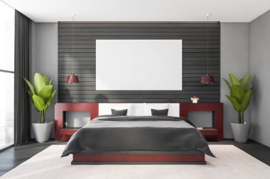 Gri ve ahşap duvarları, beton zemini, kırmızı komodinli rahat kral yatağı ve bulanık şehir manzaralı penceresi olan modern ana yatak odasının içi. Yatay maket posteri. 3d oluşturma