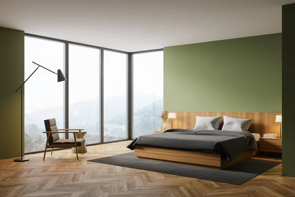 Corner of modern master bedroom with green walls, wooden floor, comfortable king size bed, armchair and window with blurry mountain view. 3d rendering