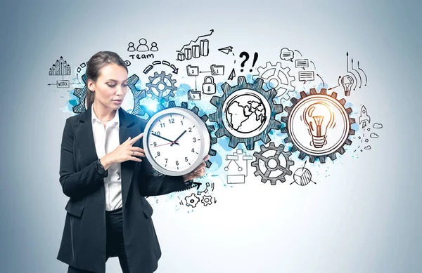 Beautiful Young European Businesswoman Holding Big Clock Gray Wall Creative — Stock Photo, Image