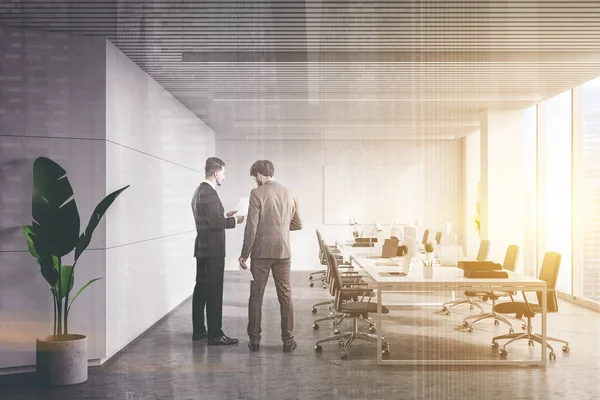 Two Young Managers Discussing Documents Panoramic White Open Space Office — Stock Photo, Image