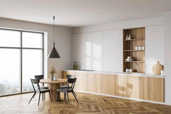 现代厨房的拐角处 有白色的墙壁 木制的地板 木制的台面 橱柜和有灰色椅子的圆形餐桌 山景朦胧的窗户 3D渲染 — 图库照片