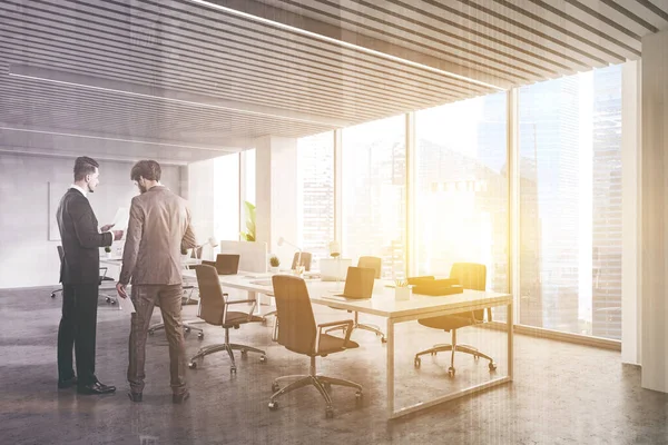 Two Young Businessmen Discussing Documents Panoramic White Open Space Office — Stock Photo, Image