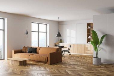 Modern mutfak ve oturma odasının köşesinde beyaz duvarlar, ahşap zemin, ahşap tezgah ve dolap yuvarlak yemek masası ve kahverengi kanepe. 3d oluşturma