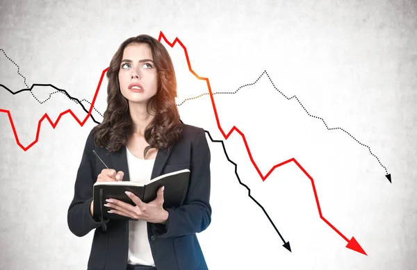 Portrait Confused Young Businesswoman Taking Notes Concrete Wall Falling Financial — Stock Photo, Image