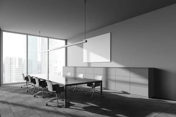 Corner of panoramic industrial style meeting room with gray walls, carpeted floor, long conference table with gray chairs and window with blurry cityscape. Horizontal mock up poster. 3d rendering