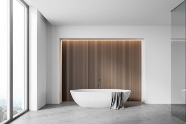 Panoramik banyo, beyaz ve ahşap duvarlar, beton zemin, üzerinde havlu asılı rahat küvet ve bulanık dağ manzaralı pencere. 3d oluşturma